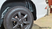 Close-up of GX 460 mud flap delete fitment behind rear wheel