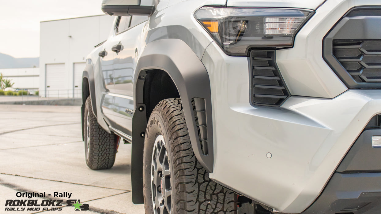 2024 Toyota Tacoma featuring Rokblokz Rally Mud Flaps in Black - Front view