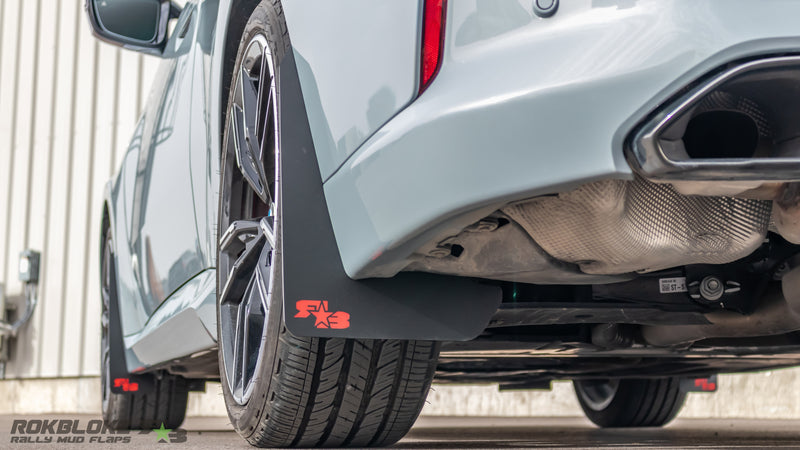Close-up of Rokblokz mud flap fitment on BMW M240i