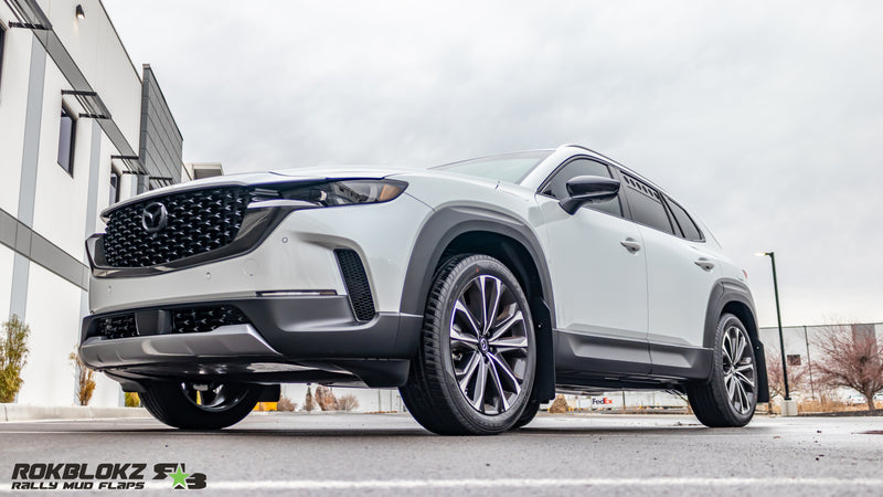 2023+ Mazda CX-50 featuring Rokblokz Rally Mud Flaps in Black - front 3/4 view