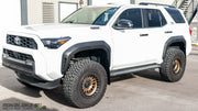 Front view of a 2025 Toyota 4Runner with Rokblokz rally-style mud flaps installed on front and rear, showing stainless hardware.