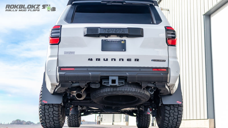 Rear view of a 2025 Toyota 4Runner with Rokblokz rally-style mud flaps installed on front and rear wheels.