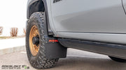 Close-up of Rokblokz Step-Back Mud Flap on Chevrolet Silverado 3500HD showing stainless hardware and durable polymer material