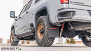 Rear angle of Chevrolet Silverado 2500/3500 HD equipped with Rokblokz Step-Back Mud Flap Kit, designed for off-road durability.