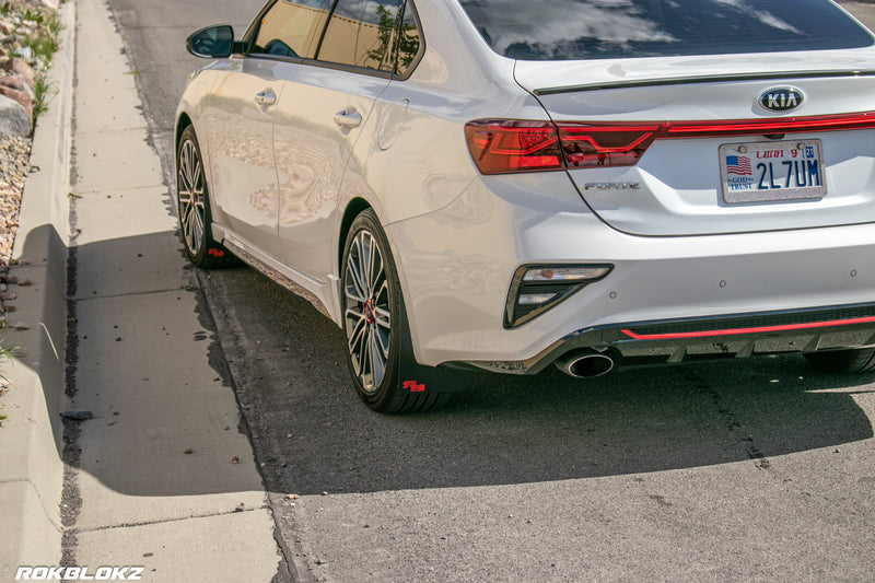 2020 Kia Forte GT Featuring Rokblokz Mud Flaps in Black w/ Red logo - driver side