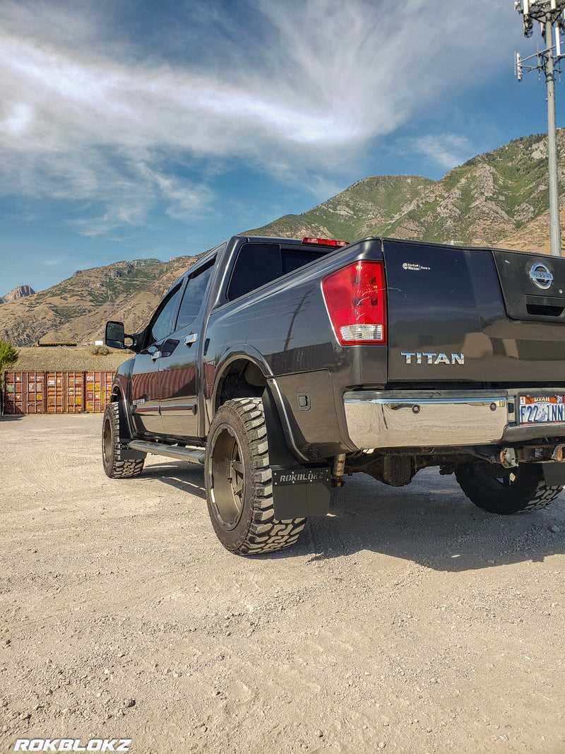 Nissan Titan Featuring Rokblokz Step-Back Mud Flaps in Black - Works with fender tool box